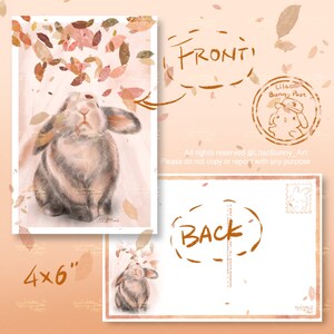 May include: A 4x6 inch postcard with a watercolour illustration of a bunny and falling leaves. The front of the card shows the bunny looking upwards, with the word "FRONT" above. The back of the card has the word "BACK" and a stamp design.