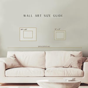 Pode incluir: Um guia de tamanhos de arte de parede com o texto "WALL ART SIZE GUIDE". O guia mostra dois ret&acirc;ngulos emoldurados rotulados "20" x 16"" e "14" x 11"". Uma linha horizontal abaixo &eacute; rotulada "90 in (228,6 cm)".