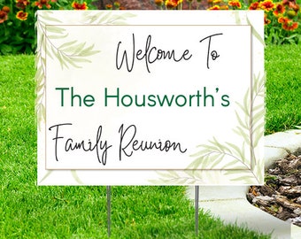 May include: White welcome sign with green leafy branches and gold accents. The sign reads "Welcome To The Housworth's Family Reunion".