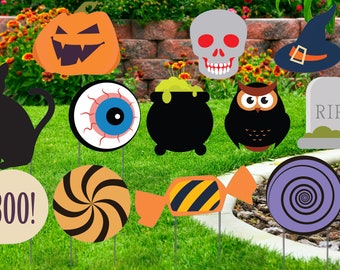 May include: A collection of Halloween-themed yard decorations. Includes a black cat, pumpkin, skull, witch hat, eyeball, cauldron, owl, tombstone, and various candies, all on stakes for easy placement in the yard.