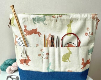 Large Cotton Canvas Hare/Bunny Drawstring Project Bag. 6 front pockets and sturdy denim base. Perfect for knitting, crochet, & other crafts