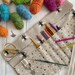 Crochet Hook Roll or Interchangeable Needle Case with stitch marker ring and 9 pockets. Perfect crafting gift 