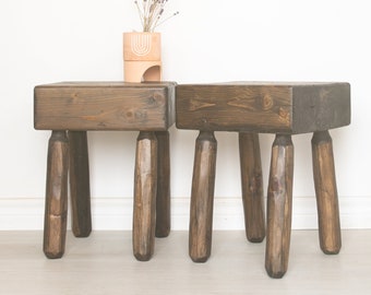 Chunky top rustic four legged stool. Made from century old barnwood timber beam and handcarved legs.