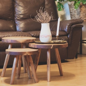 Large variable top reclaimed wooden tripod stool. Tripod round top end table