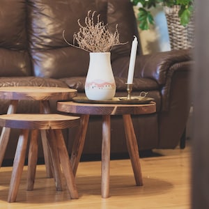 Large variable top reclaimed wooden tripod stool. Tripod round top end table