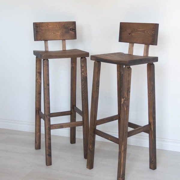 Handcrafted espresso brown, variable height bar chair. Bar stool made from reclaimed wood with foot and back rest.