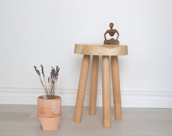 Four legged natural modern stool. Handmade wooden 4 legged stool for a minimalist modern space