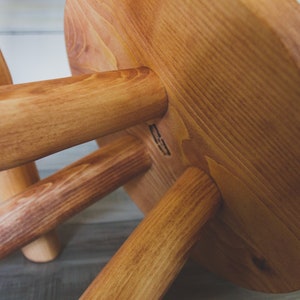 Large variable top reclaimed wooden tripod stool. Tripod round top end table