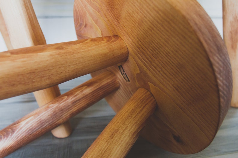 Large variable top reclaimed wooden tripod stool. Tripod round top end table