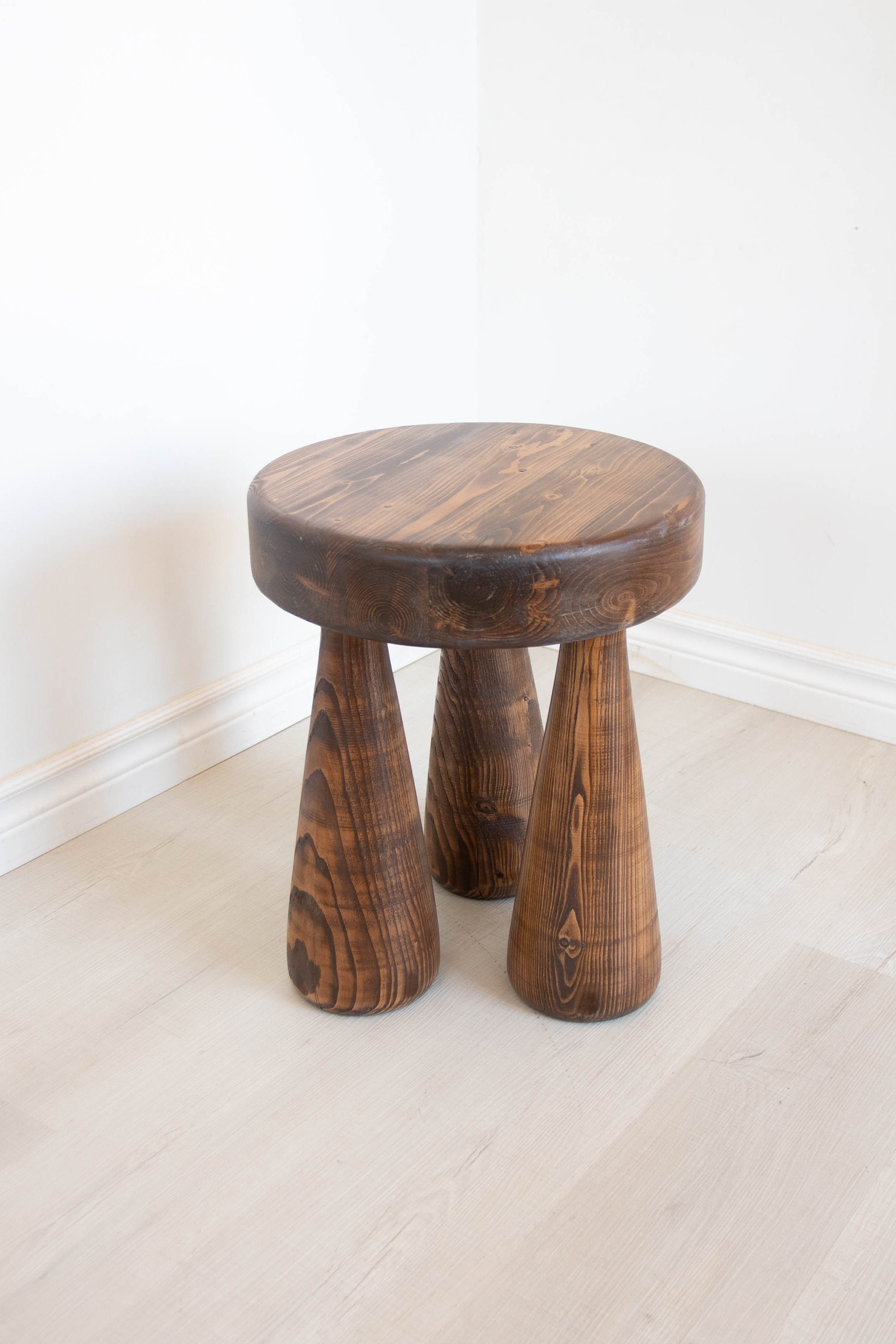 Straight legged, thick, club leg stool. Reclaimed wooden tripod large club legged table