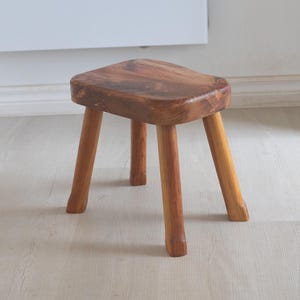 Vintage design solid pine 4 legged stool. Short milk stool with 4 legs and live edged rectangular top