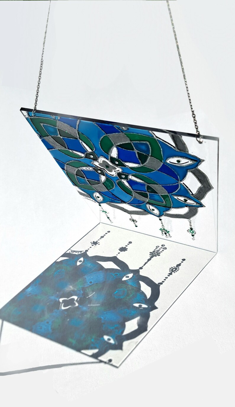 Painted on a 20×15 cm acrylic sheet (plexiglass) which is more durable and lighter than glass, makes it suitable for hanging on the window.