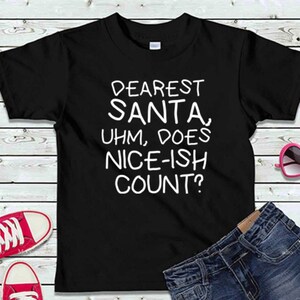 May include: Black t-shirt with white text that reads "Dearest Santa, Uhm, Does Nice-ish Count?"