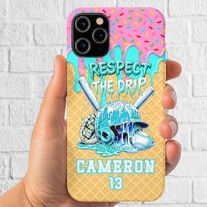 May include: A phone case with a baseball theme. The top has a pink frosted design with sprinkles, and blue drips. The center features a baseball helmet, bats, and a baseball. The text "RESPECT THE DRIP" and "CAMERON 13" are also displayed.