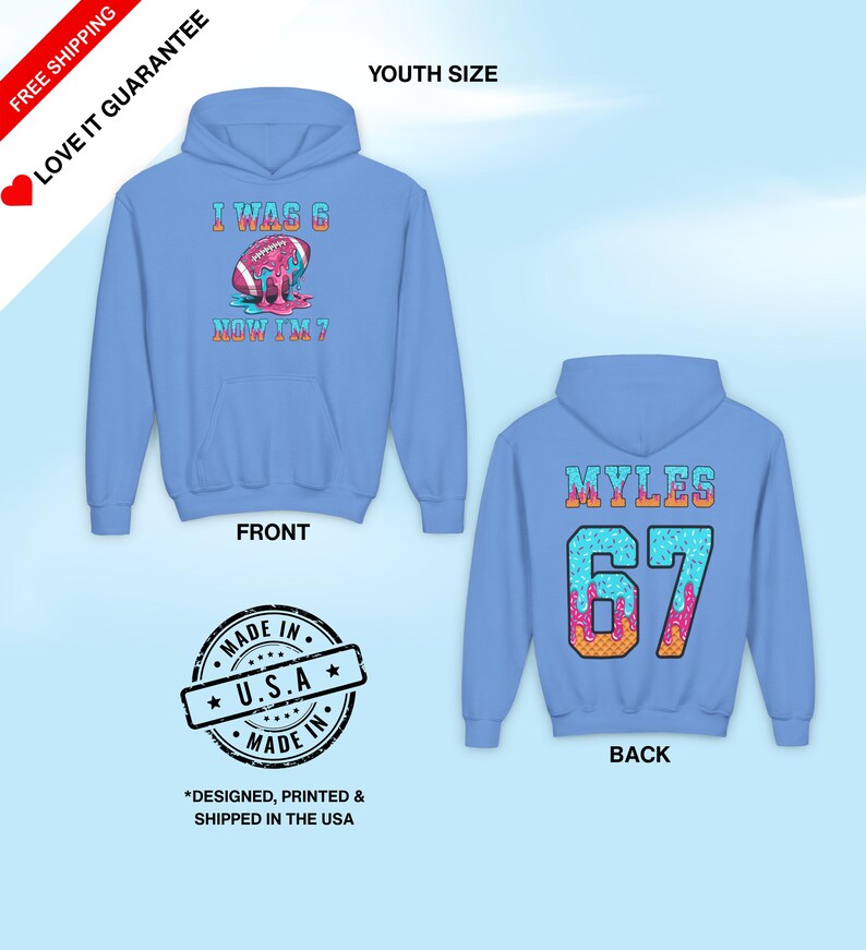 May include: Light blue youth hoodie with a front graphic of a football with the text "I WAS 6 NOW I'M 7". The back of the hoodie has the name "MYLES" and the number "67". The hoodie is made in the USA.