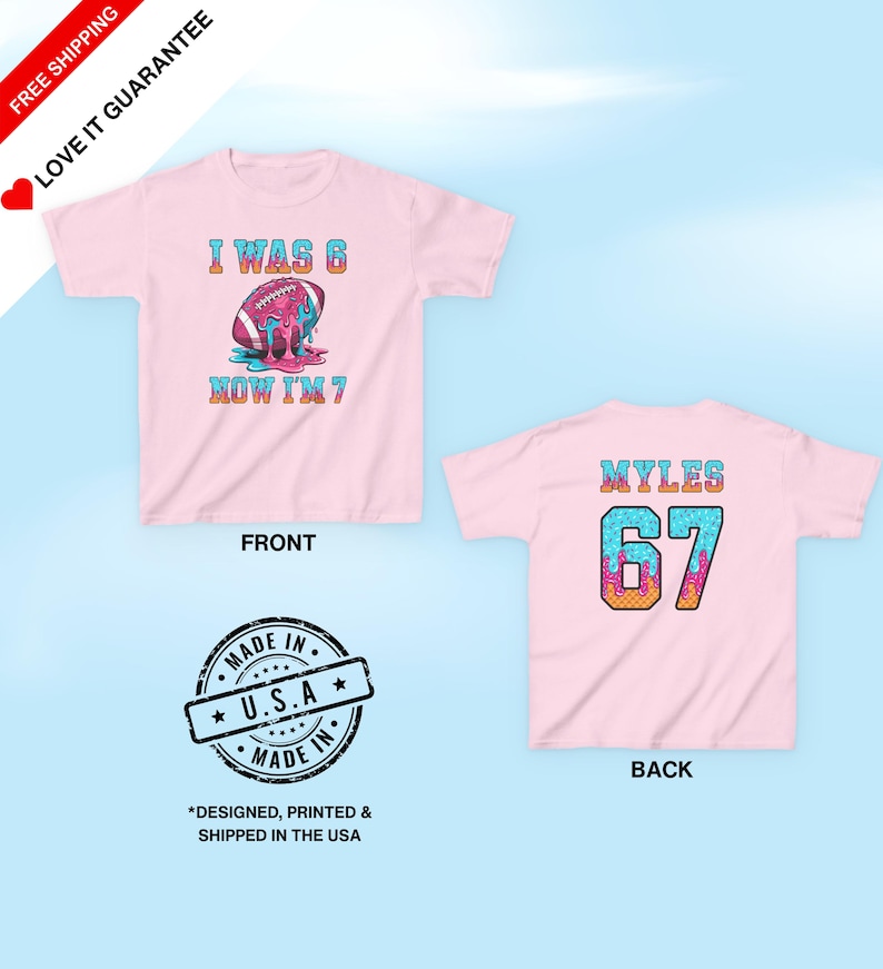 May include: Pink t-shirt with a football graphic and the text "I WAS 6 NOW I'M 7" on the front. The back of the shirt has the name "MYLES" and the number "67". The shirt is designed, printed, and shipped in the USA.