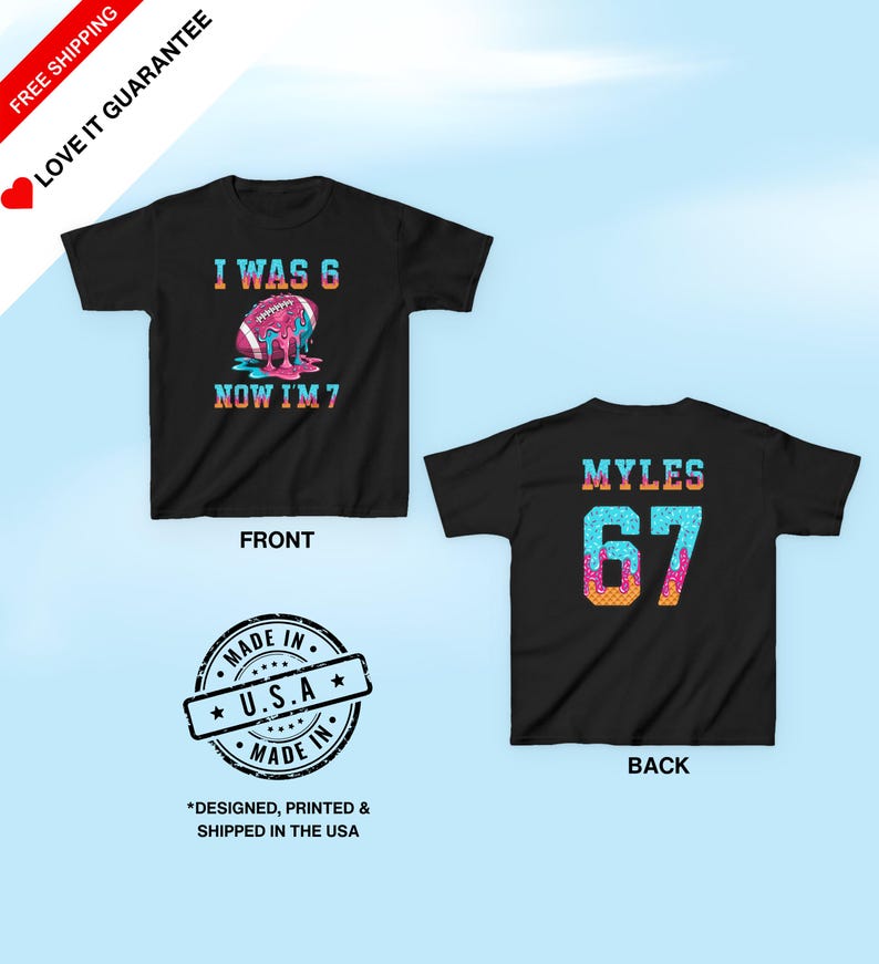 May include: Black t-shirt with a colorful football graphic that reads "I WAS 6 NOW I'M 7" on the front. The back of the shirt has the name "MYLES" and the number "67". The shirt is made in the USA.