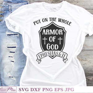 May include: White t-shirt with black text that reads "Put on the whole armor of God Ephesians 6:11" with a shield graphic.