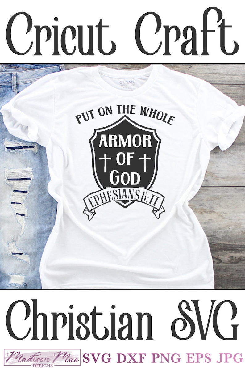 May include: White t-shirt with black text that reads "Put on the whole armor of God Ephesians 6:11". The text is in a shield shape with a cross on each side.