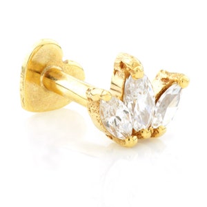 May include: A gold marquise diamond ear stud with a heart-shaped post. The ear stud features five marquise diamonds set in a row.