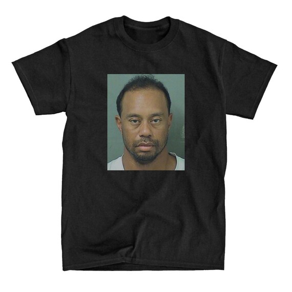 tiger woods sees mugshot shirt