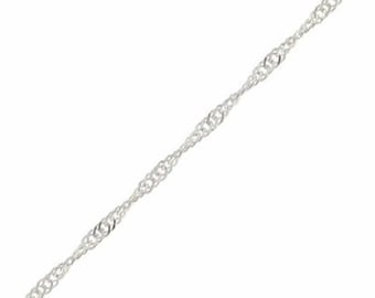 May include: A silver chain necklace with a delicate, twisted design.