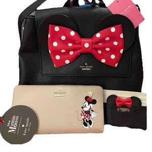 May include: A white ceramic mug with a black handle and the text "But First, Coffee" in a black, handwritten-style font. The mug is on a white surface.