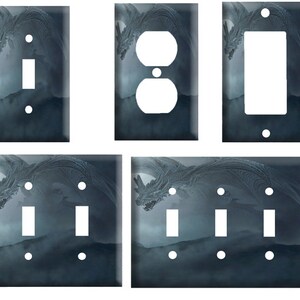 May include: Three different light switch covers featuring a dark blue and gray dragon design. The first cover is a single switch, the second is a single outlet, and the third is a triple switch.