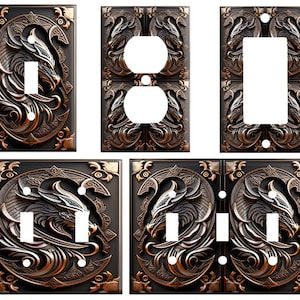 May include: Set of six decorative wall plates featuring a stylized dragon design in a bronze finish. The plates are designed to fit over standard light switch and outlet covers.