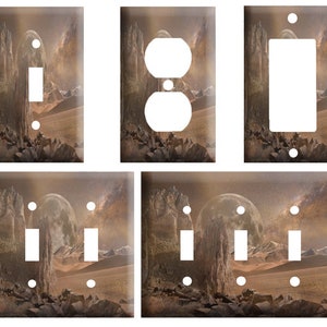 May include: Set of six light switch and outlet covers featuring a fantasy landscape with a full moon, rocky mountains, and a starry sky. The covers are available in single, double, and triple switch configurations.