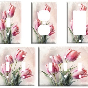 May include: Set of six light switch and outlet covers featuring a watercolor painting of pink tulips on a light pink background.