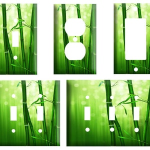 May include: A set of decorative light switch and outlet covers featuring a vibrant green bamboo forest design. The covers include single switch, double switch, outlet, and multiple switch configurations, all with a glossy finish.