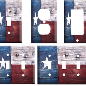 May include: Four different light switch and outlet covers featuring a distressed wood design with the Texas flag. The flag is blue, white, and red with a white star in the blue section. The covers are made of durable plastic and are easy to install.