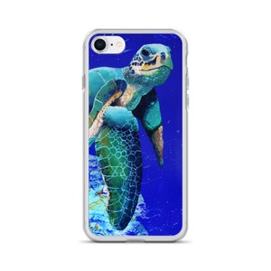 May include: A clear phone case with a colorful illustration of a sea turtle swimming in blue water.