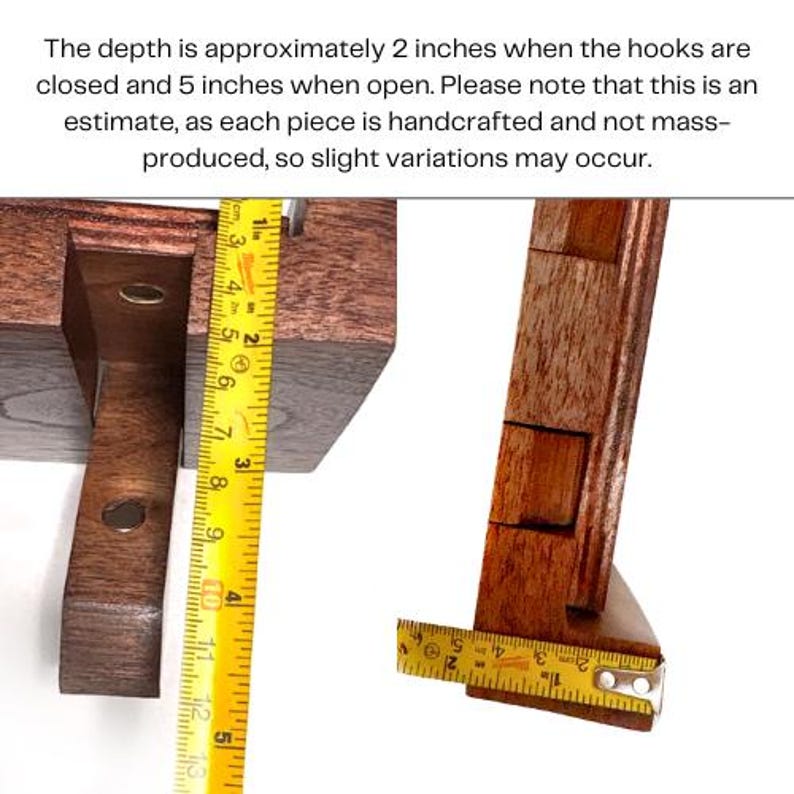 May include: Close-up of a handcrafted wooden object with a measuring tape. The depth is approximately 2 inches when closed and 5 inches when open. The wood is a rich brown color. The text in the image says, "The depth is approximately 2 inches when the hooks are closed and 5 inches when open."