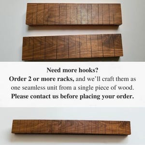 May include: Three wooden racks with multiple vertical grooves. The racks are a warm brown color and appear to be made of hardwood. The text in the image reads "Need more hooks? Order 2 or more racks, and we'll craft them as one seamless unit from a single piece of wood."