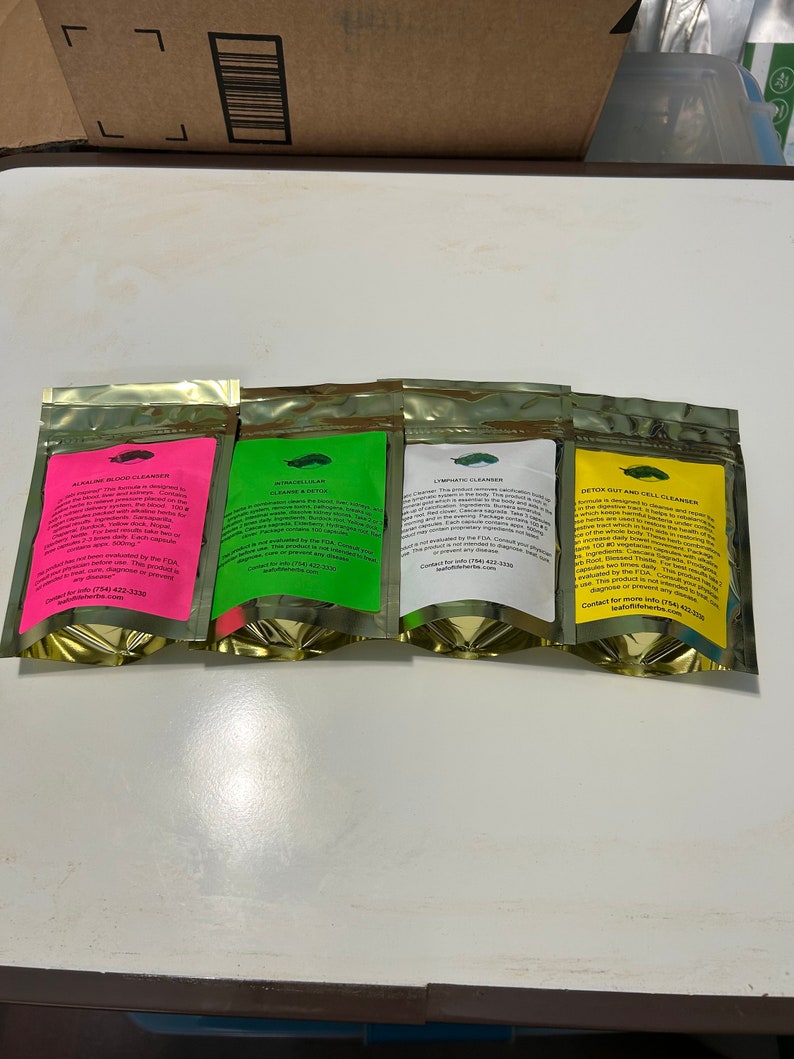 May include: Four foil pouches with different colored labels: pink, green, white, and yellow. Each pouch has a gold zipper and contains text describing the product as a cleanser. The text includes the product name and contact information.
