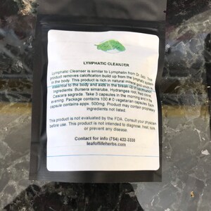 May include: A black and white label with green leaf design for Lymphatic Cleanser. The label lists ingredients, dosage, and contact information for Leaf of Life Herbs.