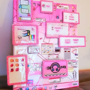 May include: A pink and white mixed media artwork featuring various computer-themed elements. The piece includes framed images of Windows 95, error messages, and chat bubbles. Text includes "Oh Fuck" and "Fuck that".
