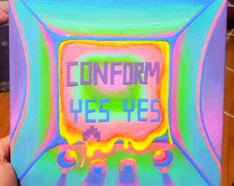 Op de afbeelding: Een schilderij op canvas met een kleurrijk, abstract ontwerp. Het schilderij toont een computerscherm met de woorden "CONFORM YES YES" in een pixellettertype.