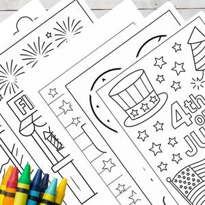May include: A stack of black and white coloring pages with patriotic themes, including fireworks, stars, and an American flag. Crayons in various colors are in the foreground, ready for use. The pages are designed for the 4th of July.