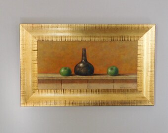 May include: A still life painting of a dark brown bottle and two green apples on a shelf. The painting is framed in a gold frame.