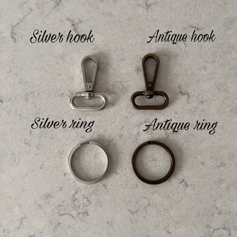 May include: Two silver and two antique metal hooks and rings. The silver hook and ring are on the left, and the antique hook and ring are on the right. The silver hook and ring are both shiny, while the antique hook and ring are both dull and have a brown patina. The text 'Silver hook', 'Silver ring', 'Antique hook', and 'Antique ring' are written below each item.