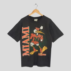 Vintage 90s Miami Hurricanes NCAA Black T shirt Medium University of Miami Apparel Printed Shirt U of M Hurricanes Football Tee Size M