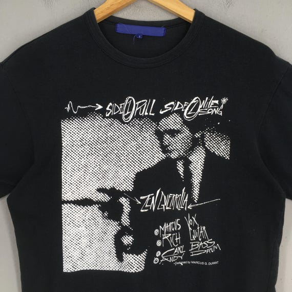 〈匿名発送〉GUERRILLAZINE COMME des GARCONS Vintage AD2004 Comme Des Garcons Zen Guerrilla Black Tshirt