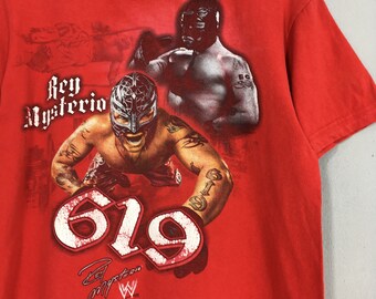 2008 WWE/ ミステリオ 総柄 レスリング Tシャツ USED］ 2008 
