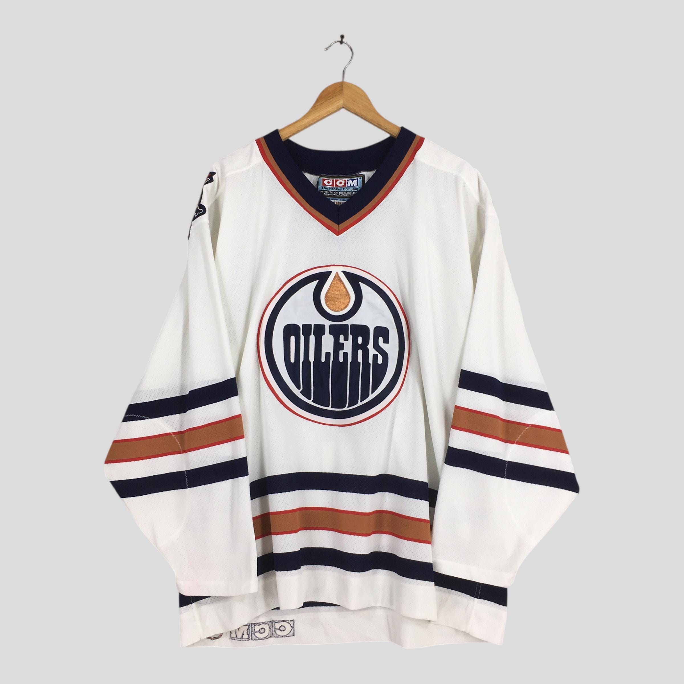 Grand chandail de hockey vintage des Blackhawks de Chicago. Authentique CCM par Maska Tag. Fabriqué aux États-Unis. Antidérapant vintage. Une très légère tache. - Canada