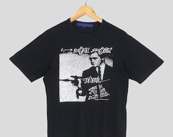 Vintage AD2004 Comme Des Garcons Zen Guerrilla czarna koszulka mała Comme Des Homme Plus CDG Junya Watanabe Marcus G Durant Design Tee rozmiar S