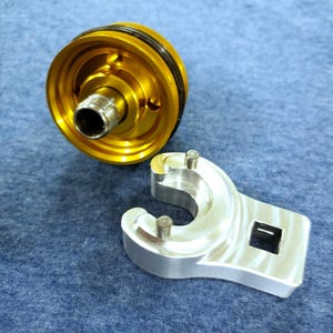 May include: A set of three ceramic mugs with a speckled, matte finish. The mugs are in shades of cream, light gray, and dark gray. Each mug has a simple, minimalist design, perfect for coffee or tea.