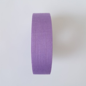 May include: A roll of purple fabric tape.
